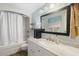 Bright bathroom featuring shower with tub, marble countertop, and modern fixtures at 228 Deleon Rd, Debary, FL 32713