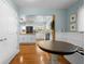 Bright dining area featuring a table, built-in bench, and view of the open kitchen at 228 Deleon Rd, Debary, FL 32713