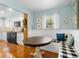 Breakfast nook featuring built-in seating, light blue paint, and an open floorplan to the kitchen at 228 Deleon Rd, Debary, FL 32713