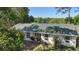 Charming single-story home with a well-maintained lawn and inviting walkway and beautiful lake view at 228 Deleon Rd, Debary, FL 32713