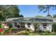 Charming home with a well-maintained front exterior, featuring beautiful landscaping and shuttered windows at 228 Deleon Rd, Debary, FL 32713