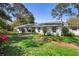 Charming single-story home with a well-maintained lawn and mature trees at 228 Deleon Rd, Debary, FL 32713