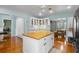 Bright eat-in kitchen featuring a butcher block island, granite countertops, and white subway tile backsplash at 228 Deleon Rd, Debary, FL 32713