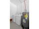 Laundry room featuring a washing machine, dryer, and Rheem Performance water heater for convenience at 228 Deleon Rd, Debary, FL 32713