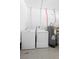 Laundry area with a washing machine, dryer, and water heater in the utility area at 228 Deleon Rd, Debary, FL 32713