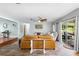 Open concept living room, leading to sun room and additional rooms at 228 Deleon Rd, Debary, FL 32713