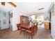 Bright dining area featuring a wooden table, chairs, and sliding doors to the backyard at 2411 Trafalgar Dr, Orlando, FL 32837
