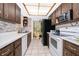 Functional kitchen with white countertops, appliances, and access to the backyard at 2411 Trafalgar Dr, Orlando, FL 32837