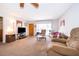 Comfortable living room featuring plush carpeting, natural light, and cozy furnishings at 2411 Trafalgar Dr, Orlando, FL 32837