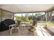 Screened patio with comfortable seating, perfect for enjoying the outdoors at 2411 Trafalgar Dr, Orlando, FL 32837