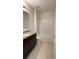 Bathroom with single sink vanity, granite countertop, and a shower/tub combination at 271 Tanglewood Dr, Davenport, FL 33896