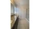 Bathroom features a double sink vanity with granite countertop and a glass-enclosed shower at 271 Tanglewood Dr, Davenport, FL 33896