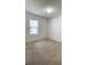 A bedroom features carpeted flooring, a window, and neutral-colored walls at 271 Tanglewood Dr, Davenport, FL 33896