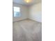 Carpeted bedroom features a window letting in natural light at 271 Tanglewood Dr, Davenport, FL 33896
