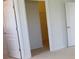 Hallway features two white doors, one leading to a room with closet space for storage at 271 Tanglewood Dr, Davenport, FL 33896