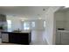 Open kitchen view with granite countertops, stainless steel appliances, and a view into the living room at 271 Tanglewood Dr, Davenport, FL 33896