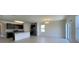 Open-concept kitchen and living area with tile floors and abundant natural light at 271 Tanglewood Dr, Davenport, FL 33896