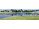 Community pond with fountain and well-maintained grassy shoreline at 271 Tanglewood Dr, Davenport, FL 33896
