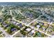 Expansive aerial view of a residential neighborhood showcasing neatly arranged homes and well-maintained landscaping at 2764 W Covington Dr, Deltona, FL 32738