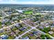 Scenic aerial of a residential area home outlined in red, near a beautiful lake, complete with lush greenery at 2764 W Covington Dr, Deltona, FL 32738