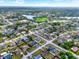 Scenic aerial of a residential area near a beautiful lake, complete with lush greenery and well-spaced homes at 2764 W Covington Dr, Deltona, FL 32738