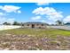 Lush green backyard with a privacy fence, offering ample space for recreation and relaxation at 2764 W Covington Dr, Deltona, FL 32738