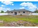 Spacious backyard featuring a well-maintained lawn and a charming patio area, perfect for outdoor entertaining at 2764 W Covington Dr, Deltona, FL 32738