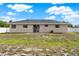 Large backyard with a concrete patio and well-maintained landscaping, creating a peaceful outdoor oasis at 2764 W Covington Dr, Deltona, FL 32738