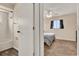 View of a bedroom with plush carpet and a bathroom with wood-look floors at 2764 W Covington Dr, Deltona, FL 32738