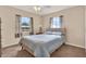Cozy bedroom with plush carpet, ceiling fan, and natural light from two windows at 2764 W Covington Dr, Deltona, FL 32738