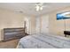 Bedroom featuring a mounted TV, a dresser, plush carpet, and neutral walls at 2764 W Covington Dr, Deltona, FL 32738