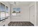 Sunlit dining area with clean white walls, wood-style flooring, and a modern ceiling fan at 2764 W Covington Dr, Deltona, FL 32738
