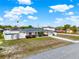 Charming single-story home with a well-manicured front yard, long driveway, and a white picket fence at 2764 W Covington Dr, Deltona, FL 32738