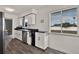 Bright kitchen features stainless steel appliances, lots of light, and wood-look floors at 2764 W Covington Dr, Deltona, FL 32738