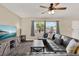 Comfortable living room with modern ceiling fan and large sofa near bright windows at 2764 W Covington Dr, Deltona, FL 32738