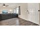 The living room features wood-look floors, modern lighting and is adjacent to the front door at 2764 W Covington Dr, Deltona, FL 32738
