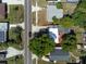 Aerial view showing homes with varied roof colors, complemented by lush trees and landscaping at 2903 E Michigan St, Orlando, FL 32806