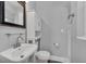 Bathroom featuring a vanity with sink, toilet, and storage cabinet at 2903 E Michigan St, Orlando, FL 32806