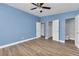 Bedroom featuring modern flooring, closet, and bathroom accessibility at 2903 E Michigan St, Orlando, FL 32806