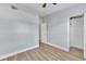 Cozy bedroom featuring wood-look floors and ample closet space at 2903 E Michigan St, Orlando, FL 32806