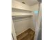 Walk-in closet with shelves and laminate floors at 2903 E Michigan St, Orlando, FL 32806