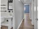 Hallway bathroom with a pedestal sink and framed mirror at 2903 E Michigan St, Orlando, FL 32806
