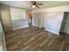 Open living room features wood-look floors and neutral paint at 2903 E Michigan St, Orlando, FL 32806