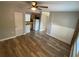 Open living room with wood-look floors leads to the kitchen at 2903 E Michigan St, Orlando, FL 32806