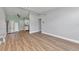 Spacious living room featuring wood-look floors, neutral paint, and plenty of natural light at 2903 E Michigan St, Orlando, FL 32806