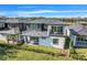 Home featuring a well-manicured lawn, a small patio, and an upstairs balcony in a contemporary style at 3024 Kensington Ave, Davenport, FL 33837