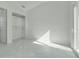 Bright bedroom features white marble floors, a walk-in closet, and a sliding glass door at 3024 Kensington Ave, Davenport, FL 33837