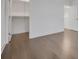 Bedroom features hardwood floors, base trim and a walk-in closet with built-in shelving and rod at 3024 Kensington Ave, Davenport, FL 33837