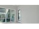 Bedroom has white marble floors, sliding glass doors offering backyard views, and a glass entry door at 3024 Kensington Ave, Davenport, FL 33837