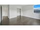 Clean bedroom features hardwood flooring, a window, and closet with no doors at 3024 Kensington Ave, Davenport, FL 33837